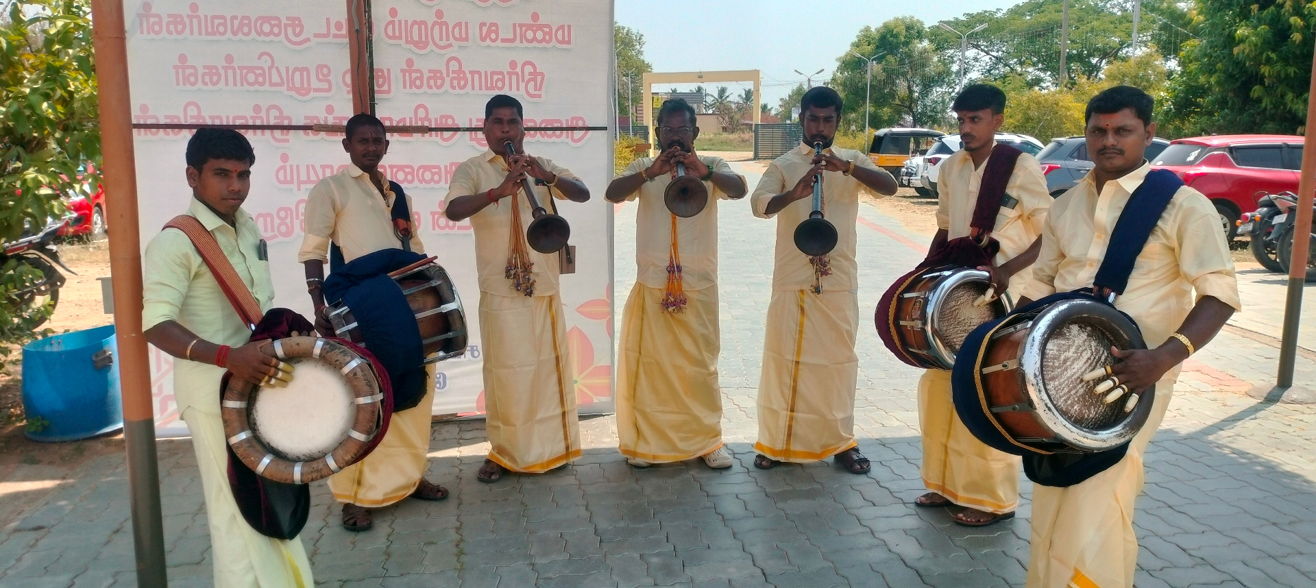 Seven Nadaswaram and Thavil artists at outdoor temple event